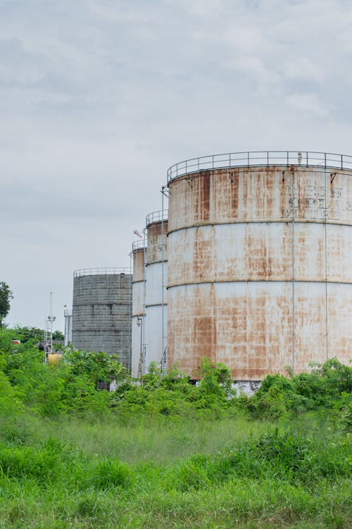 Rusty Silos in an Industrial District 