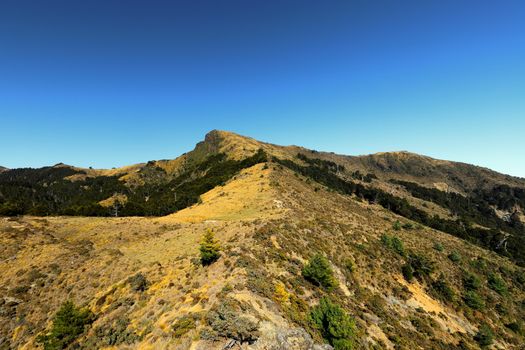 Beautiful clear sky over the rugged mountain range in Taoyuan District, Kaohsiung City, Taiwan.