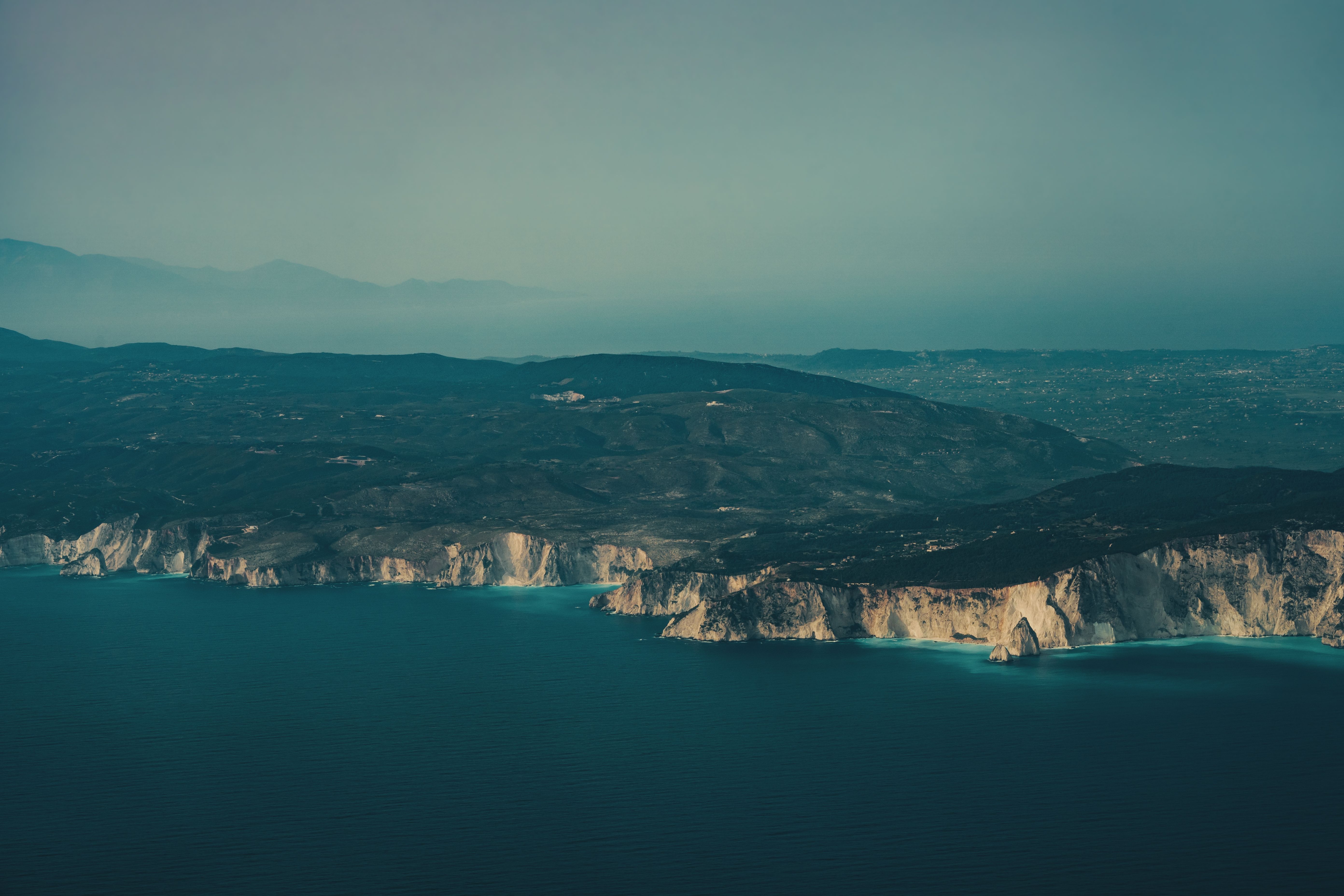 Best Private Helicopter Transfers From Mykonos Review: The Ultimate Greek Island-Hopping Experience Review 2026 - Stunning aerial shot of Zakynthos coastline, featuring dramatic cliffs and deep blue sea.