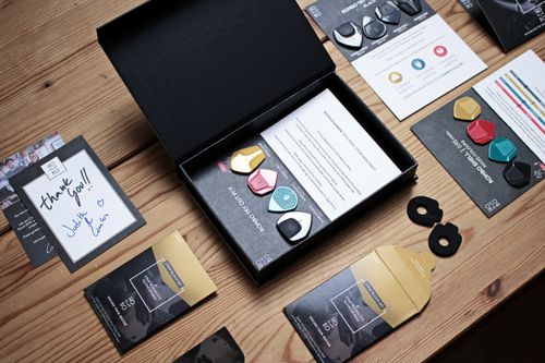 Free Overhead view of guitar picks and music accessories arranged neatly on a wooden table. Stock Photo