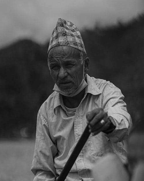 Eldery Man with a Wooden Stick 