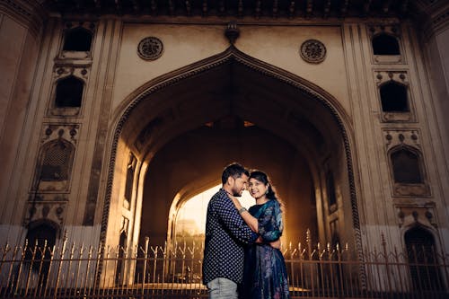 Woman and Man Posing Together