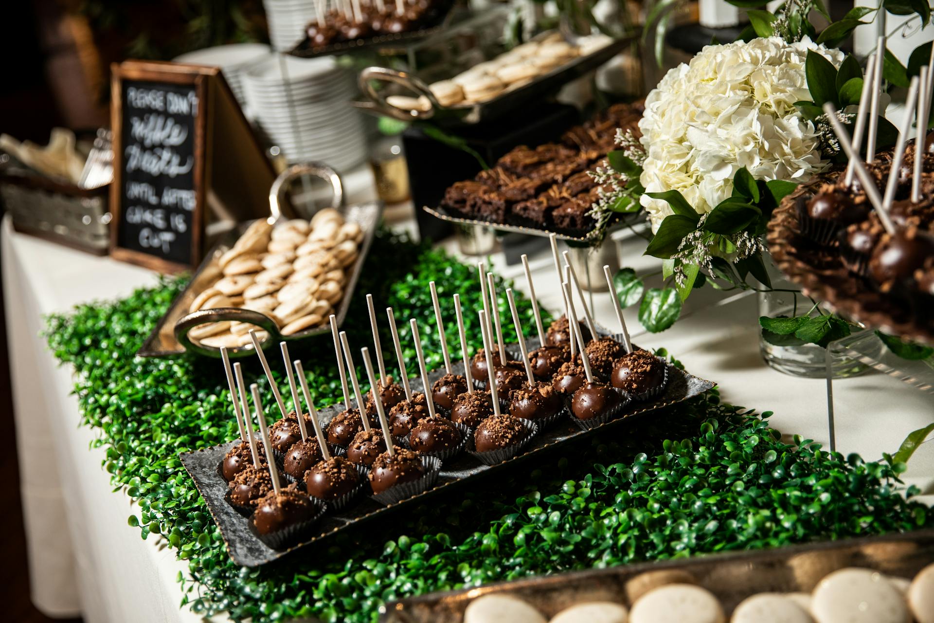 A beautiful arrangement of chocolate cake pops and desserts at a Lancaster event.