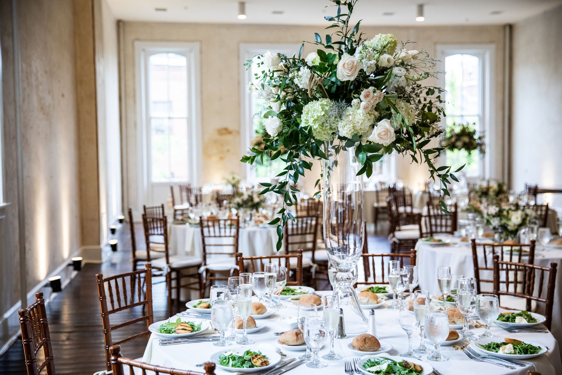Beautifully decorated wedding reception hall with floral centerpieces in Lancaster, PA.