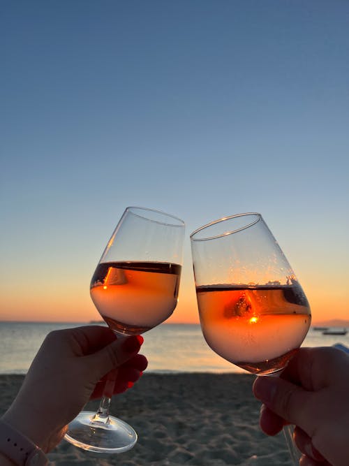 Couple Toasting Glasses on Beach