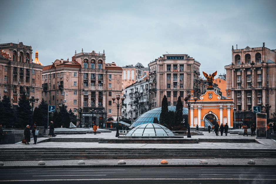 Majestic view of Kyiv's Independence Square showcasing historic architecture and vibrant urban life.