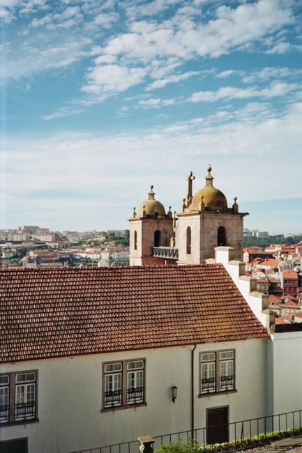Charming view of Porto's historical architecture under a bright summer sky.