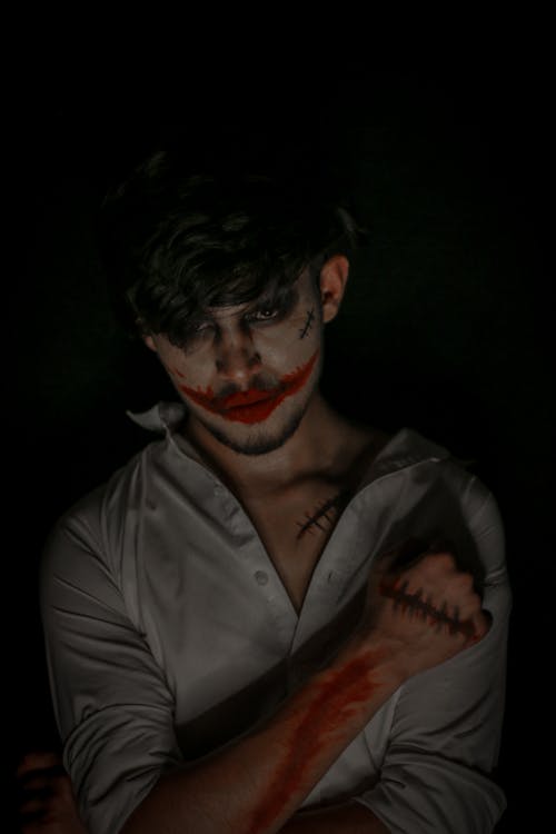 Dark Portrait of a Young Man in a Joker Costume