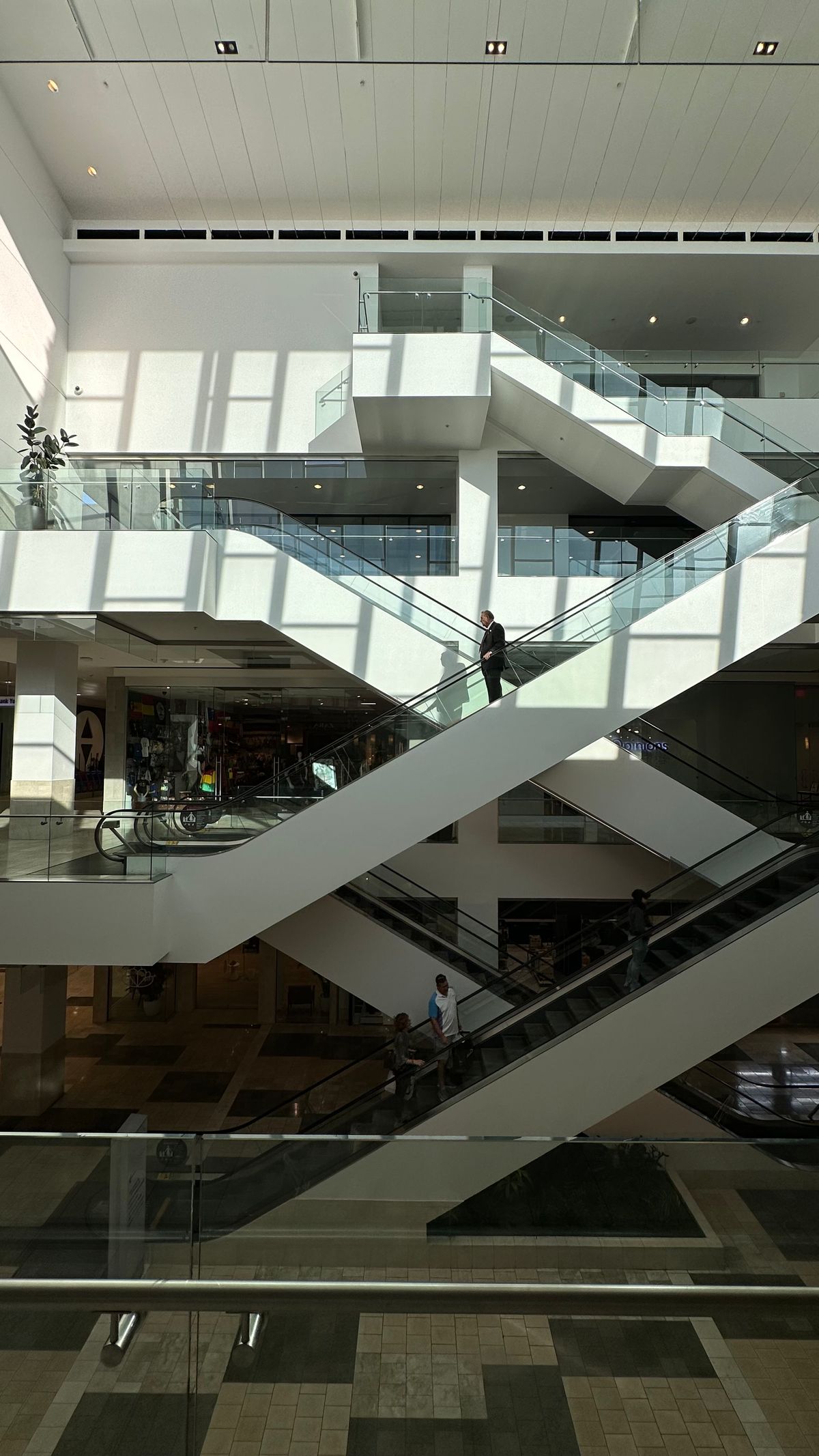 Commercial escalator transit system truss and opening coordination