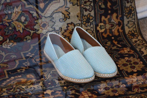 Photo of a Pair of Shoes on an Oriental Carpet