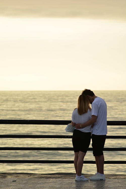 Couple Hugging on Sea Shore