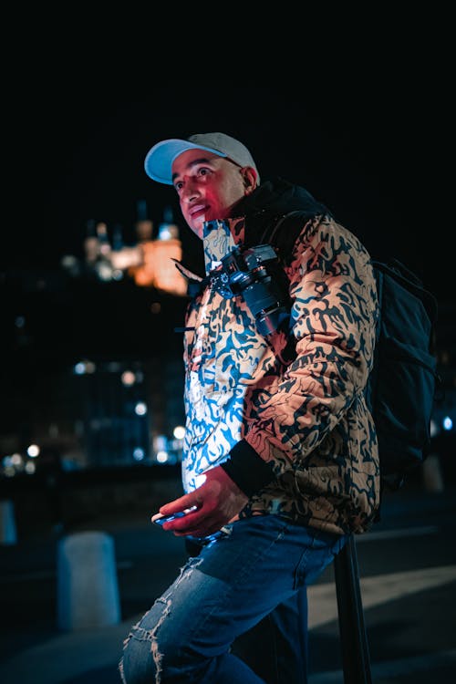 Young Man in a Jacket in City at Night 