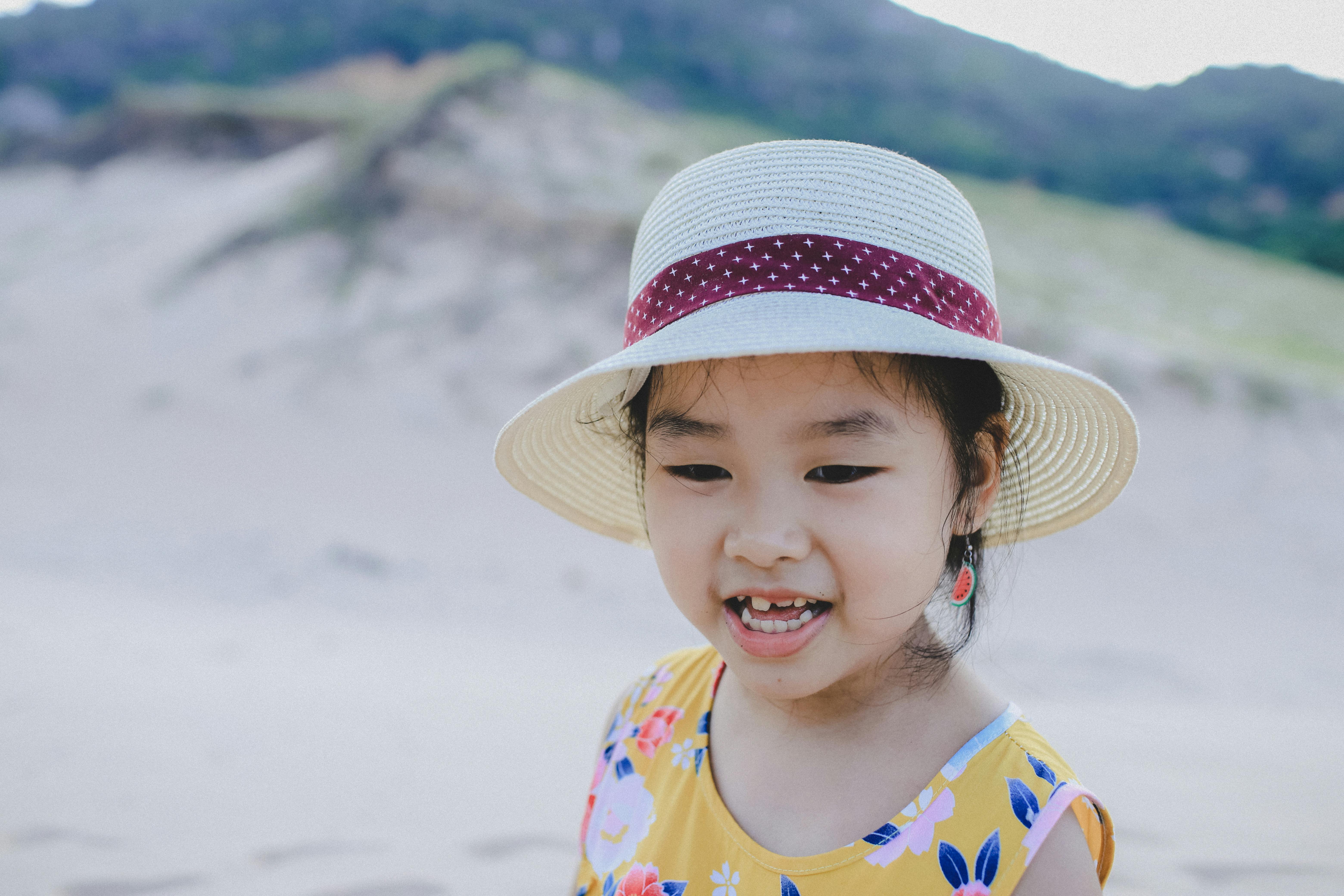 Girl Wearing White Hat Smiling