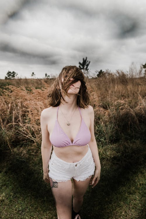 Woman in Bra on Grassland