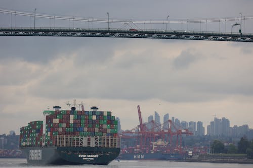 View of a Container Ship under the Lions Gate Bridge, Vancouver, British Columbia, Canada 