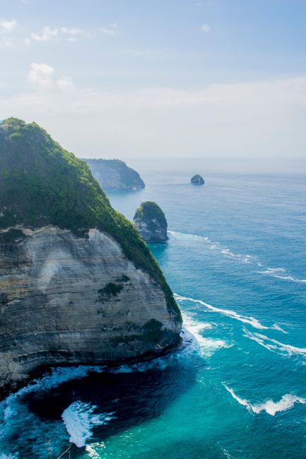 Breathtaking aerial view of Nusa Penida cliffs and ocean in Bali, Indonesia.