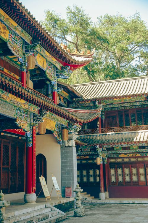 Free Detailed shot of traditional Chinese architecture with vibrant colors and intricate patterns under a clear sky. Stock Photo