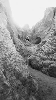 Explore the dramatic cliffs and serene trails of Canoa Quebrada, Brazil, captured at sunset.
