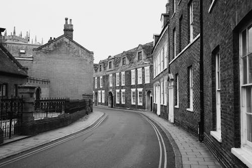 Road by Traditional Tenements in Black and White 