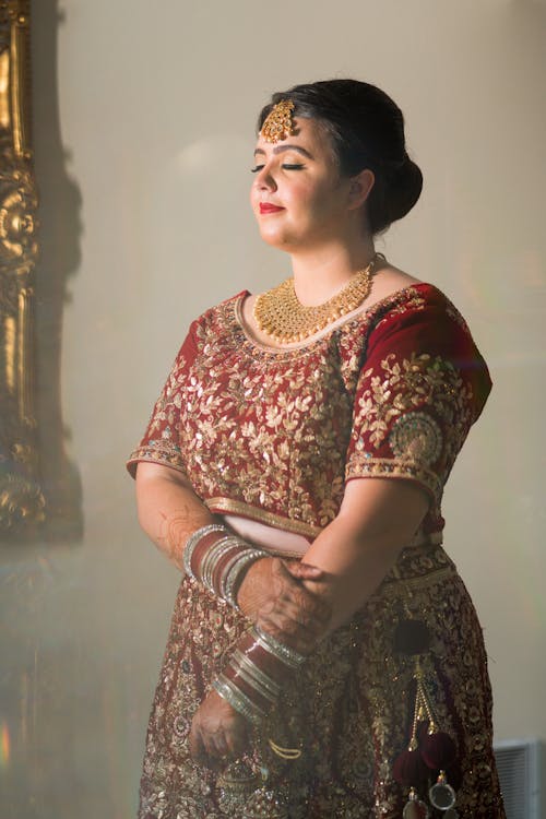 Woman Posing in Traditional Dress