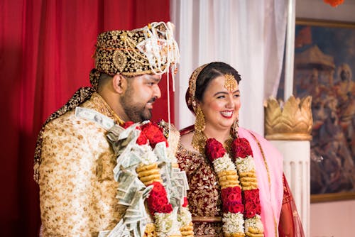 Man and Woman Posing in Traditional Clothing