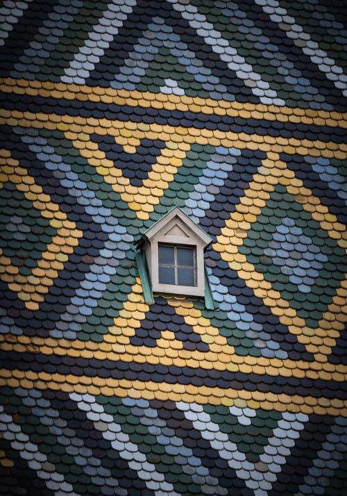 Free Detailed view of St. Stephen's Cathedral roof's colorful mosaic pattern in Vienna, Austria. Stock Photo