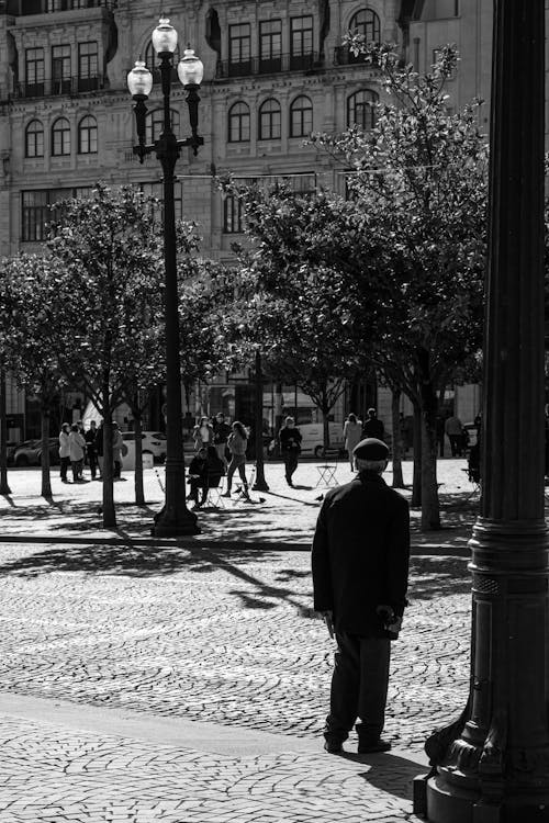 Elderly Man in City Square