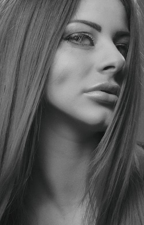 Close-up of Young Woman with Long Hair and Makeup