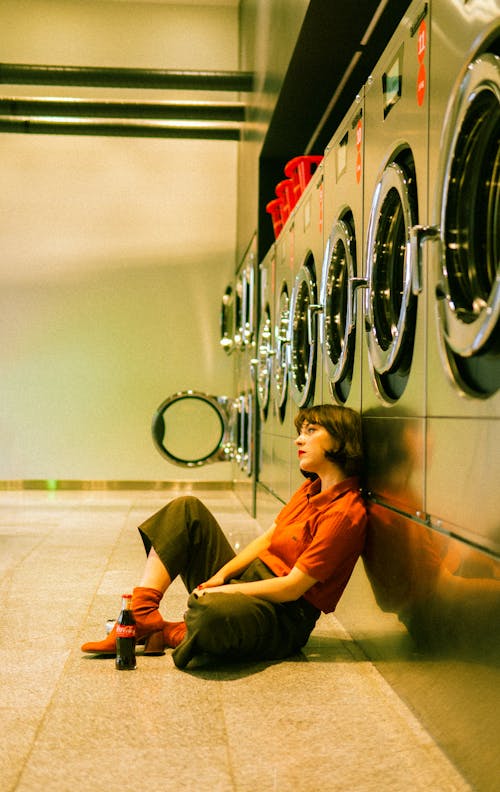 Woman Leaning on Washing Machine