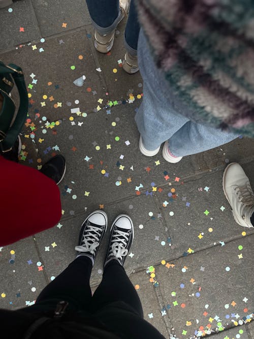 People Legs on Ground with Confetti