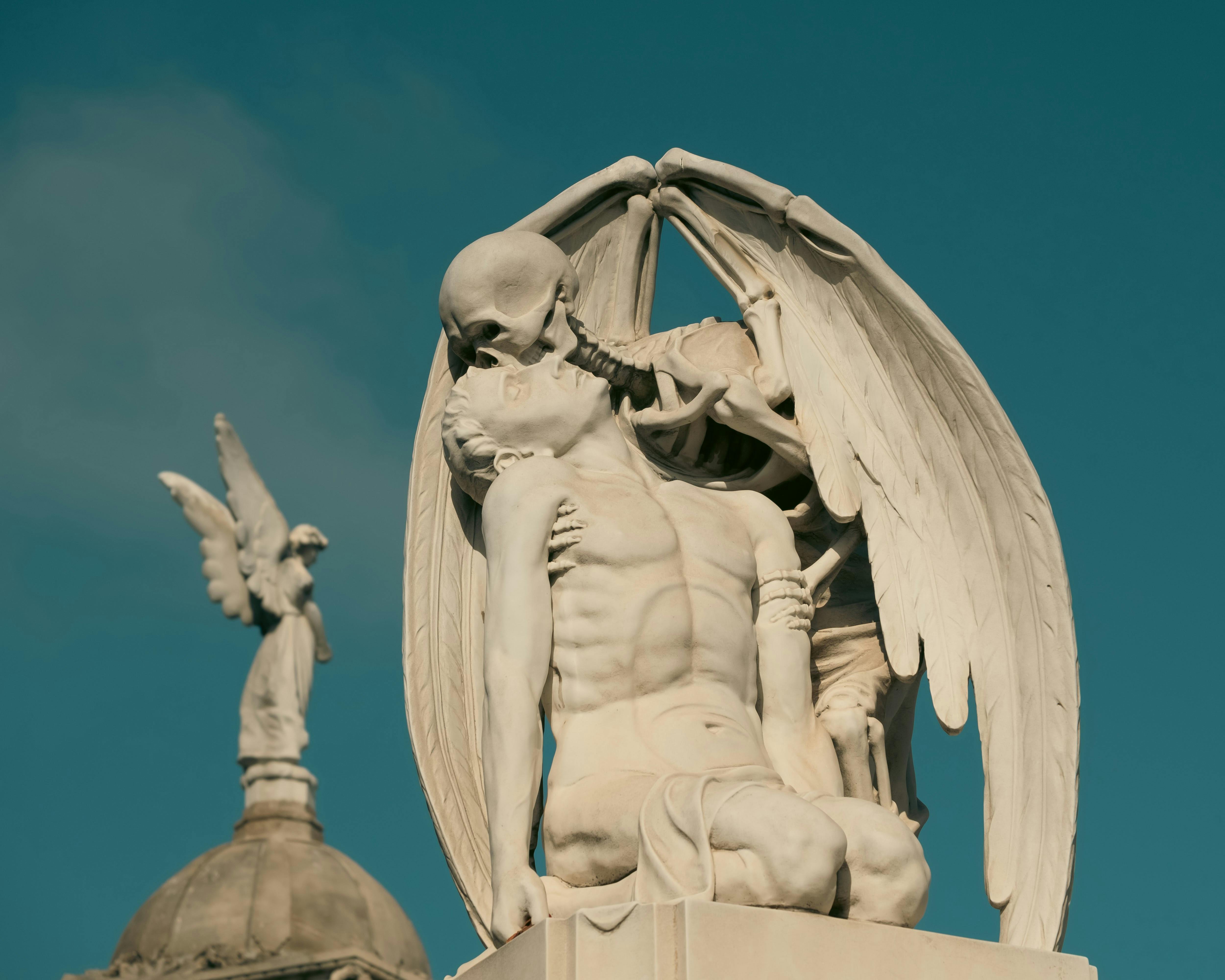 the kiss of death sculpture in poblenou cemetery in barcelona spain