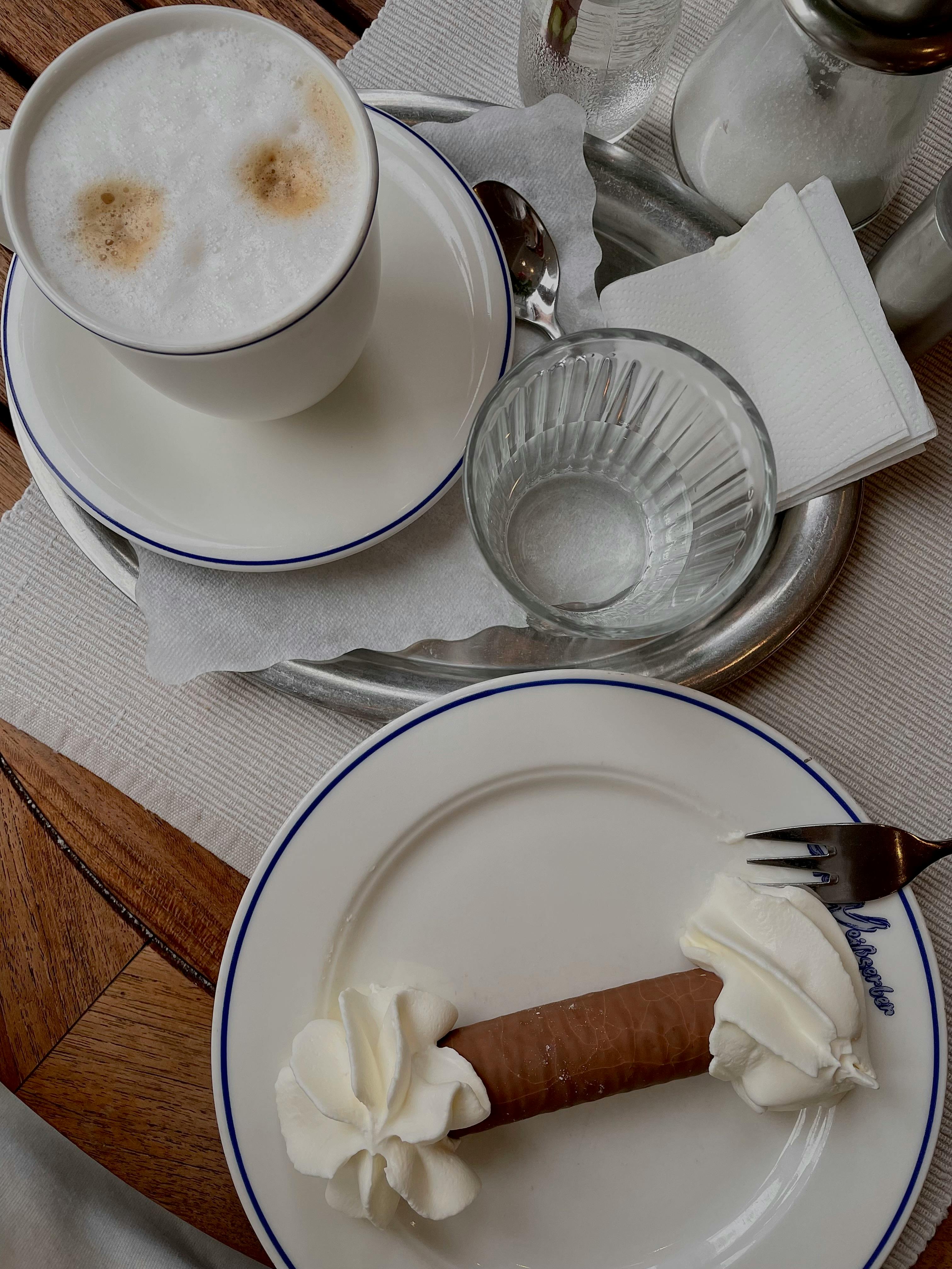 Delightful coffee and pastry served on a tray in a charming Odesa cafe.