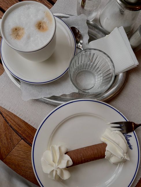 Delightful coffee and pastry served on a tray in a charming Odesa cafe.