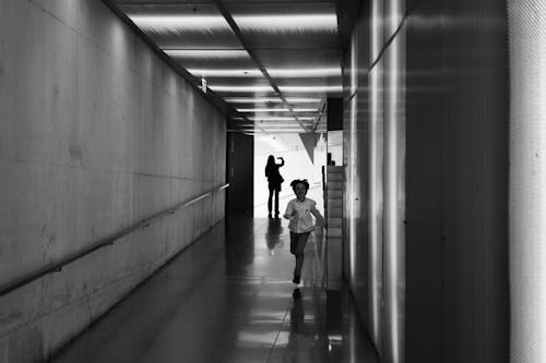 Free Person Running on Hallway Grayscale Photo Stock Photo