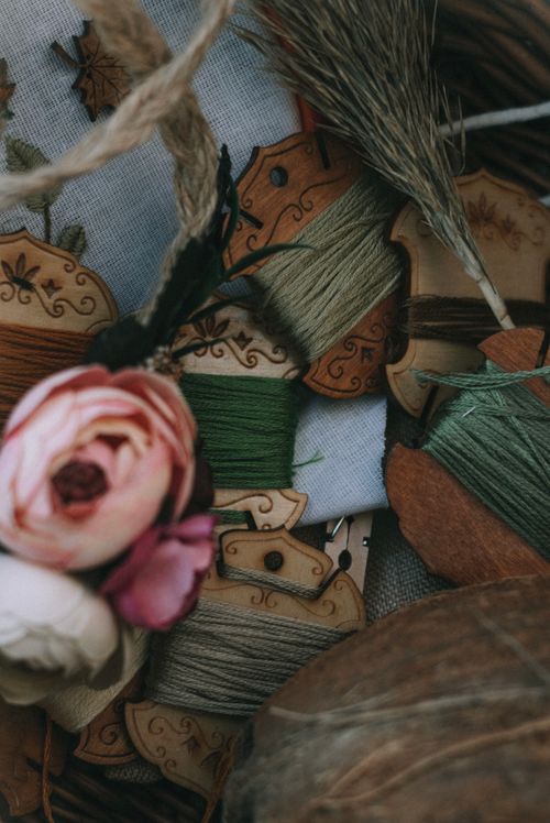 Free A close-up of colorful sewing threads and flowers, perfect for arts and crafts themes. Stock Photo