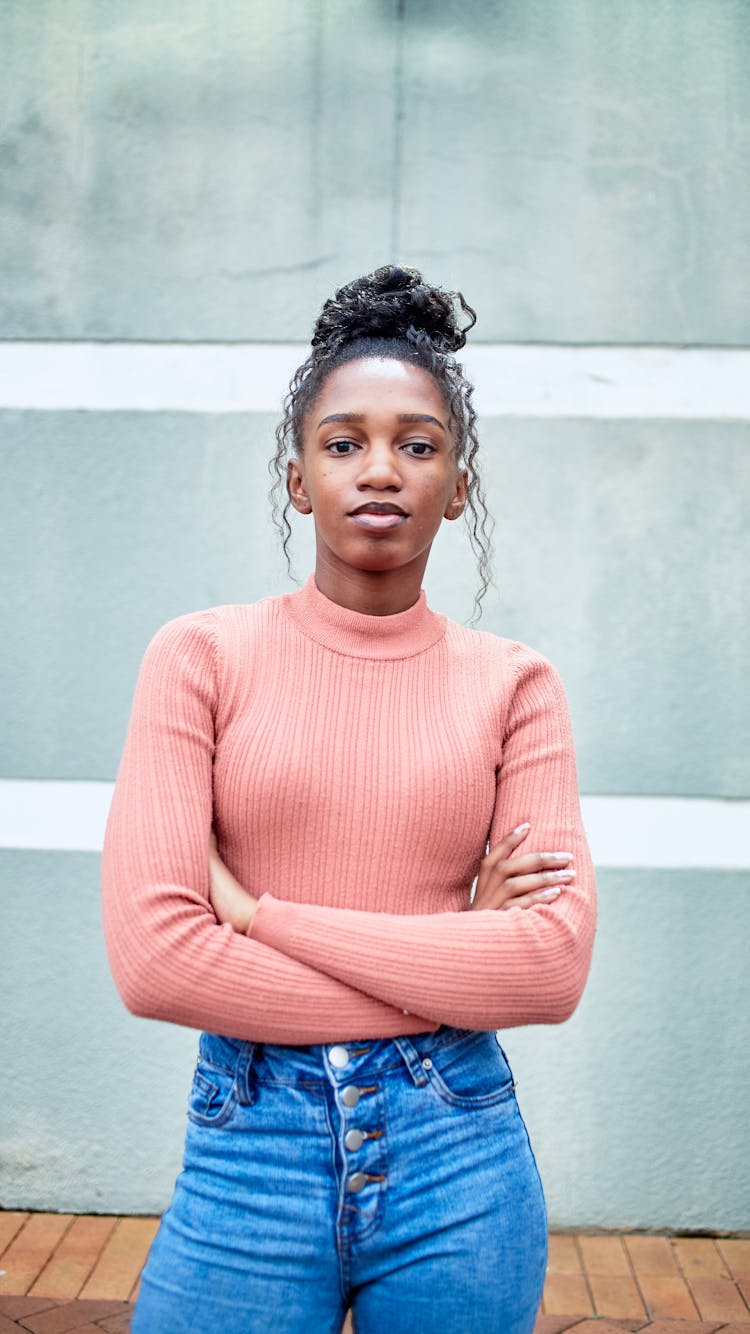 Portrait Of Woman Standing With Arms Crossed