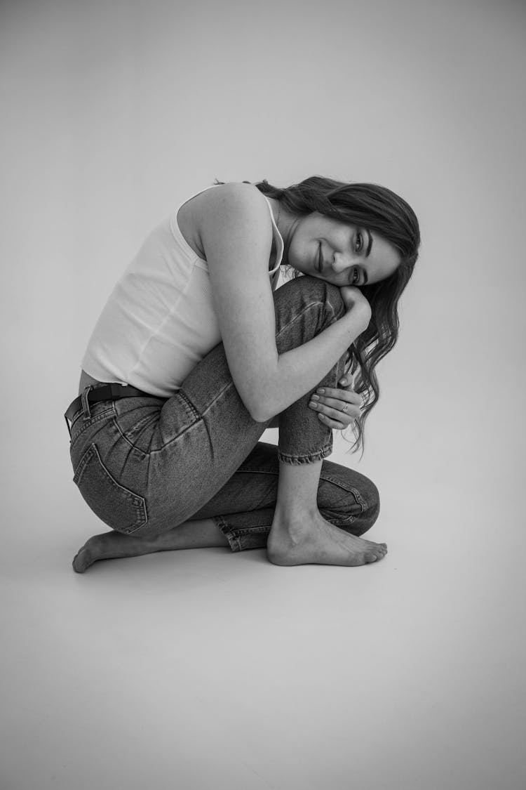 Young Woman Sitting In Studio