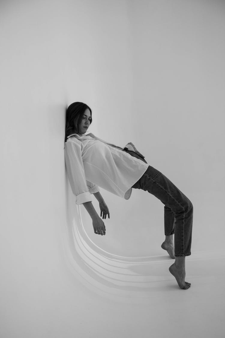 Woman Posing In White Studio