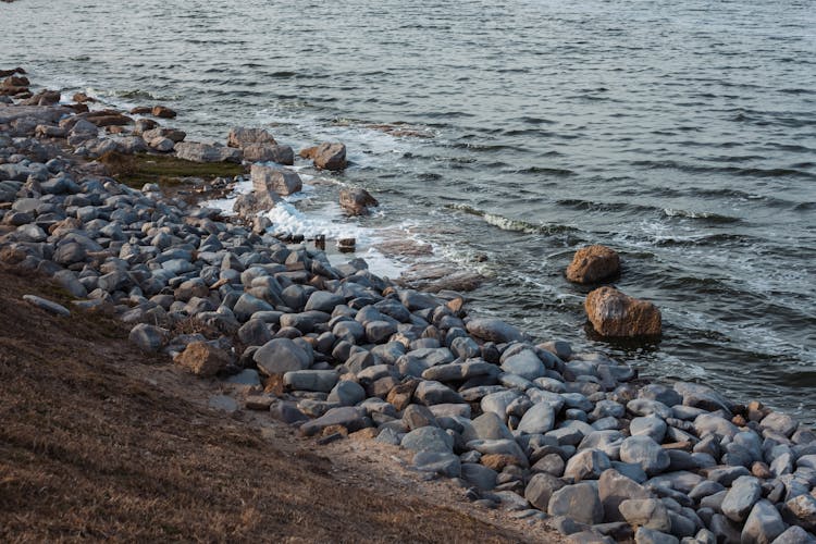 Round Rocks Piling Up On Sea Shore