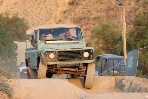 Men Driving in an Off Road Vehicle in a Desert
