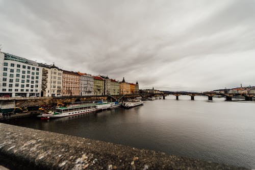 View of Prague and the Vltava River on a Cloudy Day