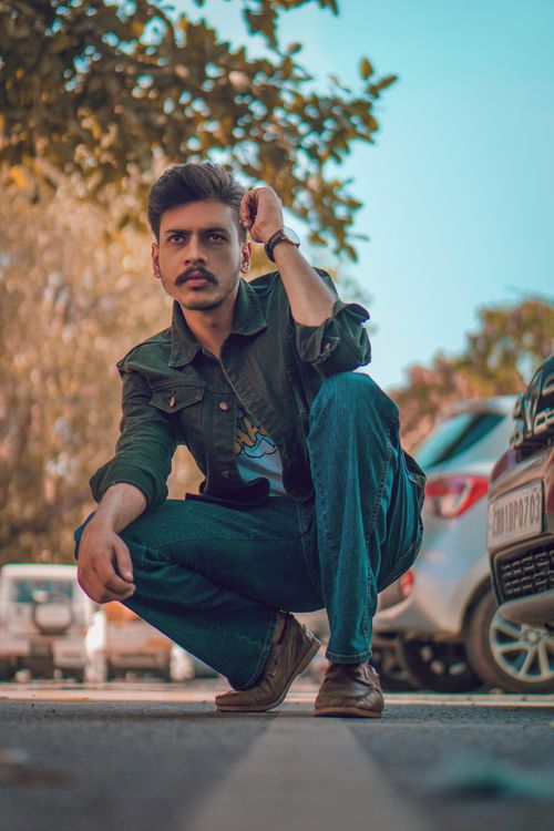 Free A stylish young man posing confidently on an urban street, showcasing modern fashion. Captured in India. Stock Photo