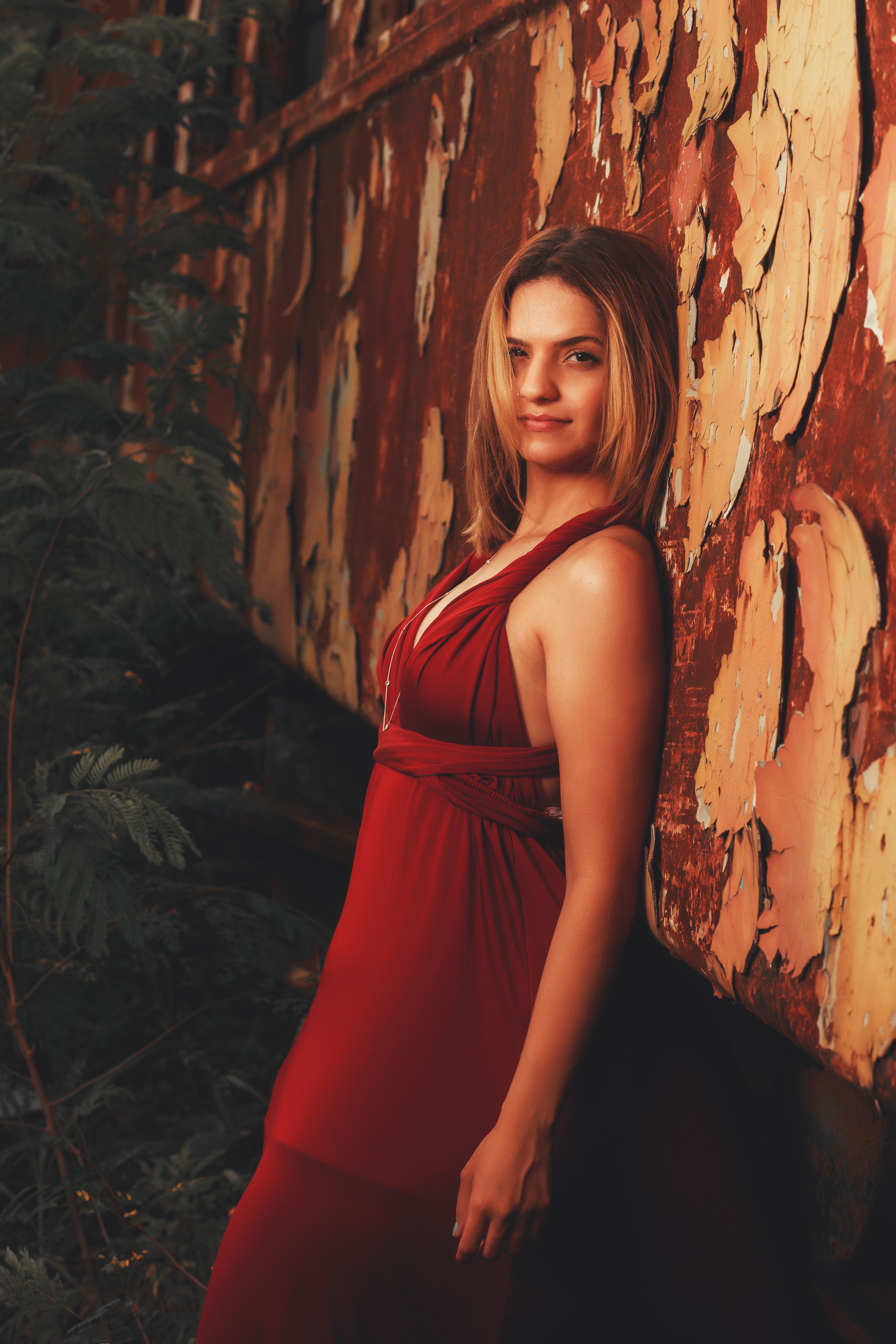 A Blonde Woman in Red Dress Posing in Urban Scenery · Free Stock Photo