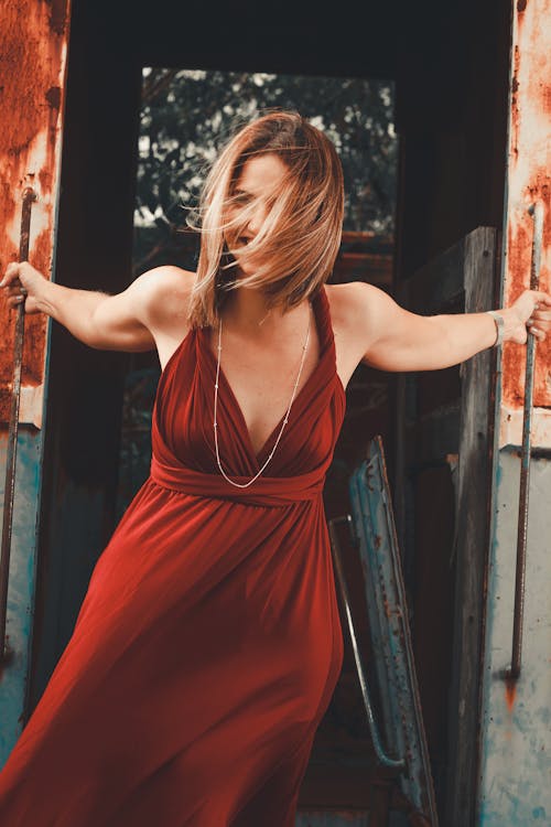 Blonde Woman Posing in Red Dress