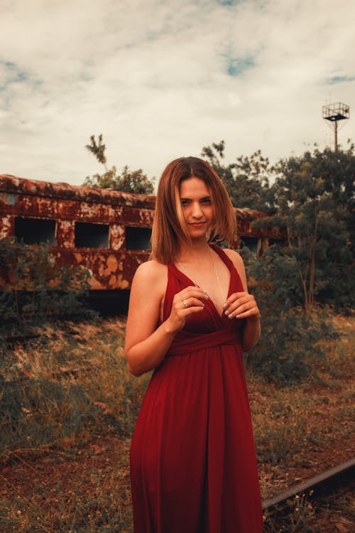 Woman Posing in Red Dress