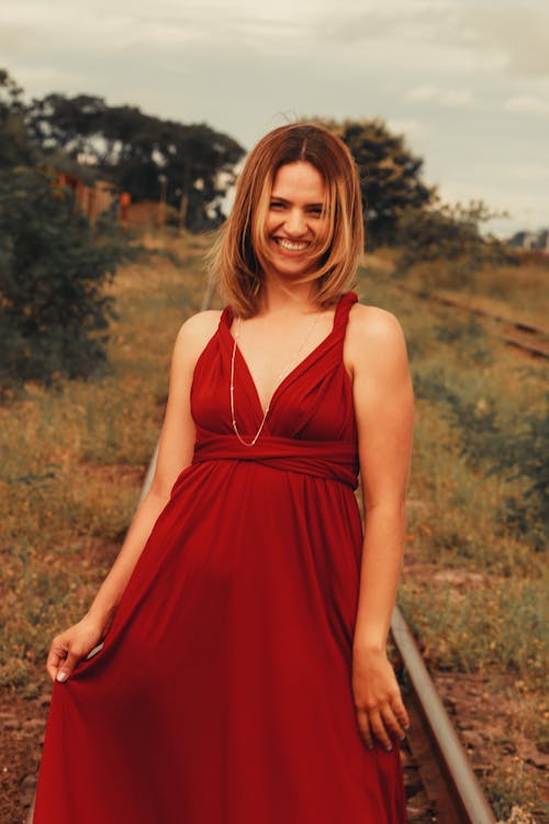 Smiling Woman in Red Dress