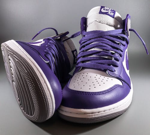 Close-up of White and Purple Nike Air Jordan 1 Sneakers 