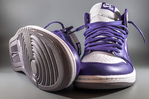 Close-up of White and Purple Nike Air Jordan 1 Sneakers 