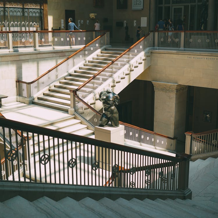 Body Figure Statue On Gray Column