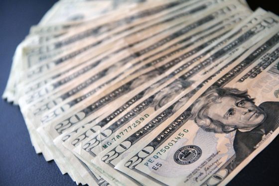 Banknotes spread on a surface — photo by John Guccione on Pexels